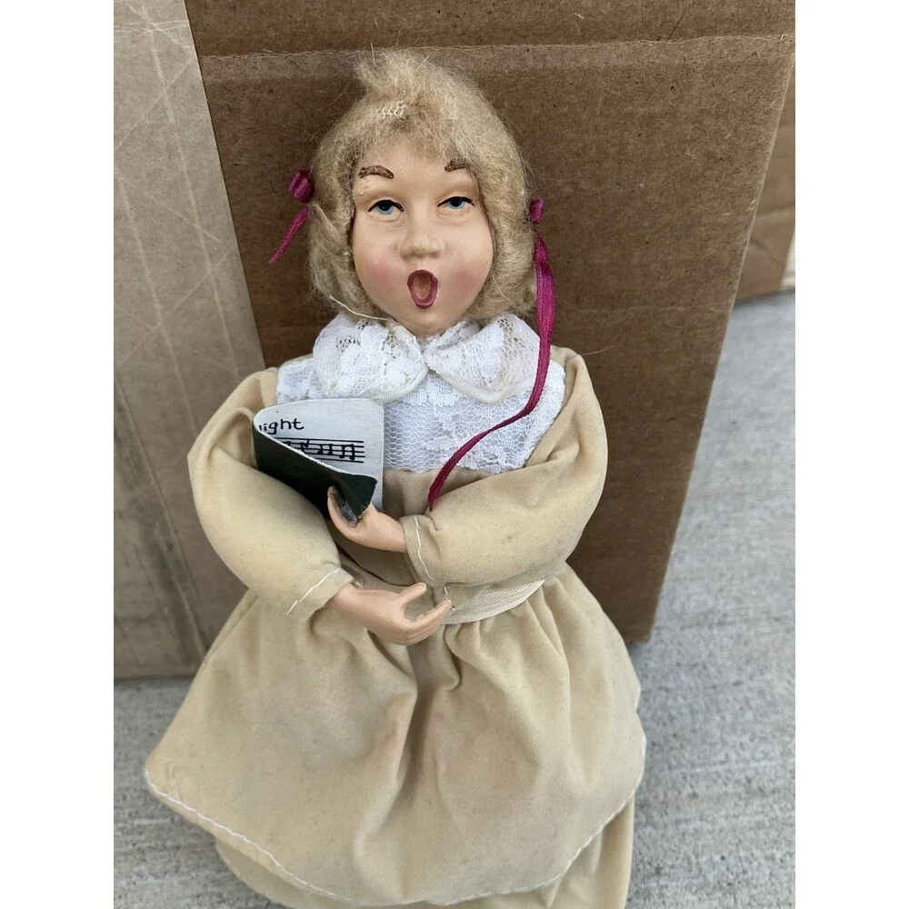 Christmas Caroler Woman Girl Figure 9 in. doll tan coat pink ribbons No Stand